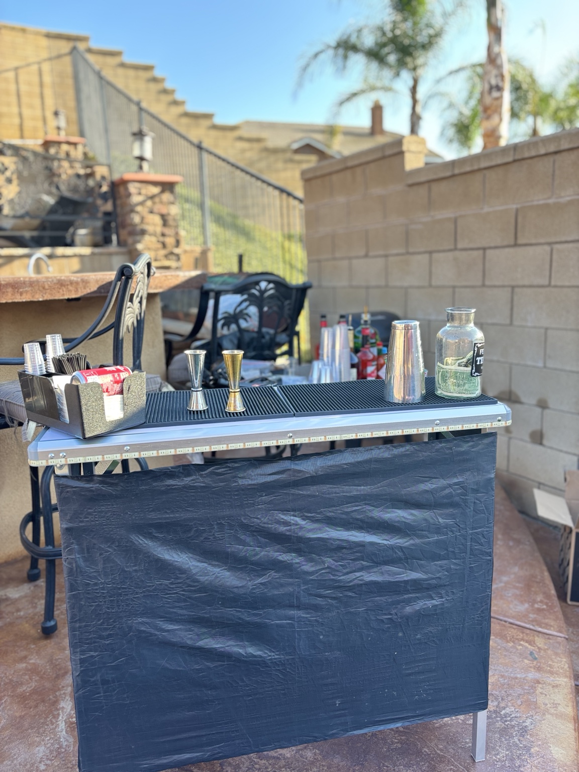 Blue-lit Bae Breeze mobile bar prepared for service